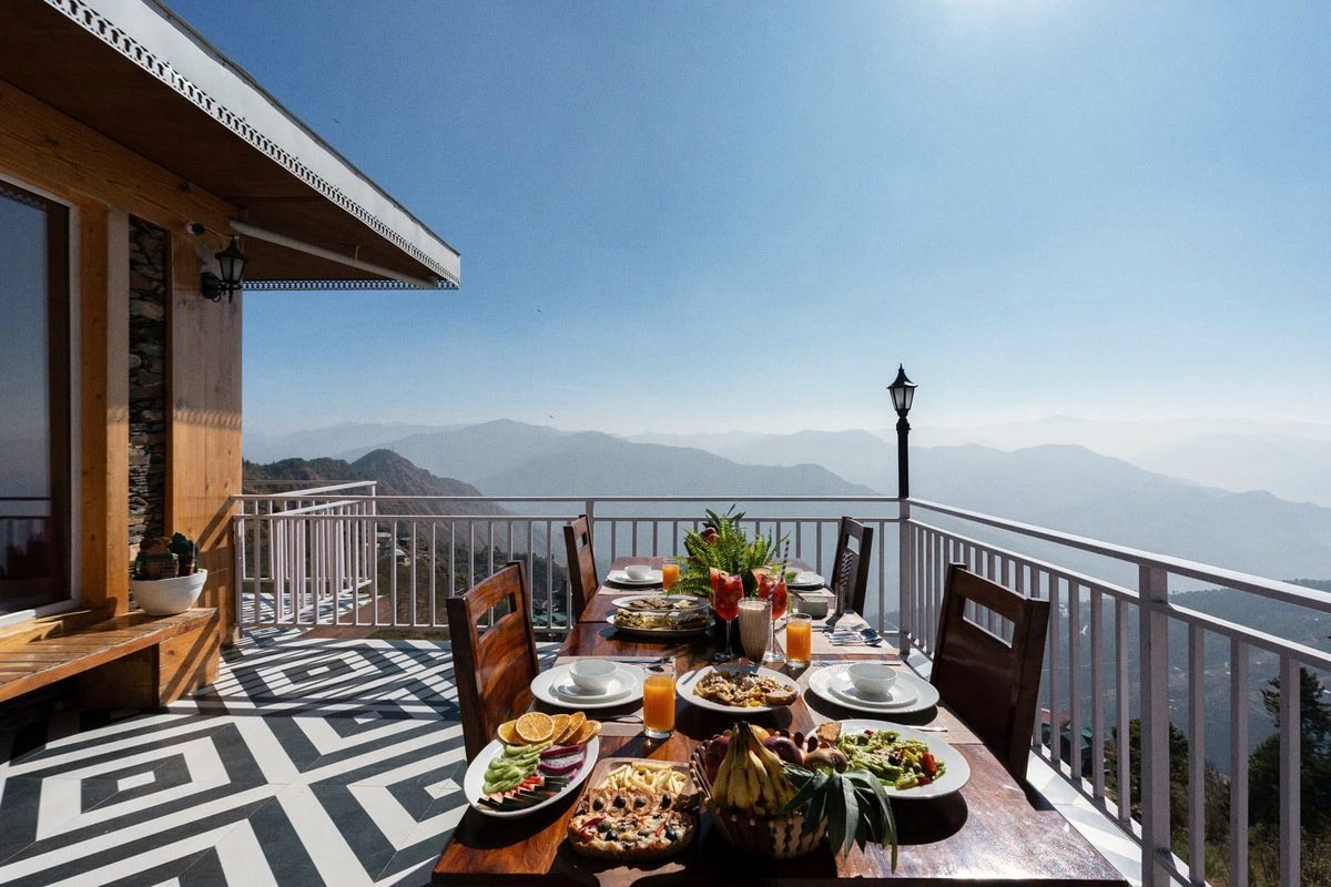A terrace laid for breakfast in the morning light