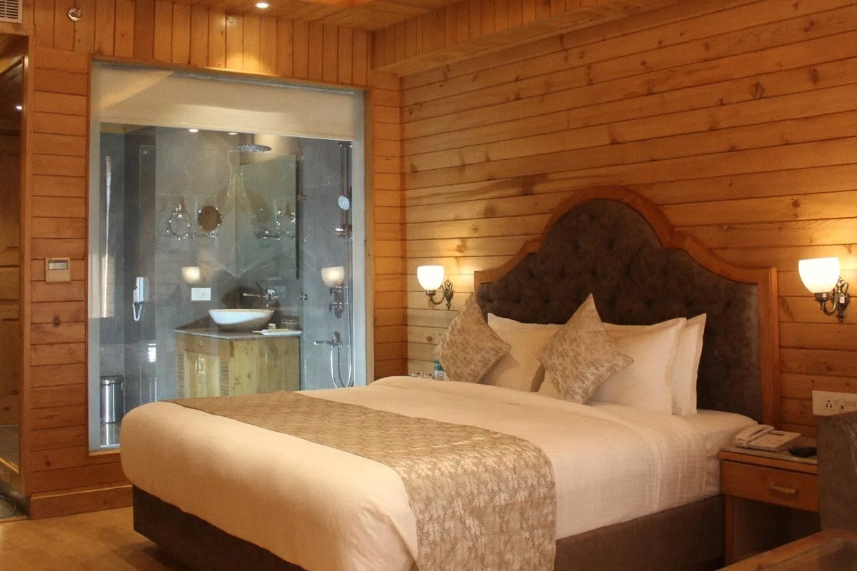 A made bed in a quiet, light-filled room